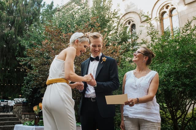 Newlyweds smiling at their wedding ceremony